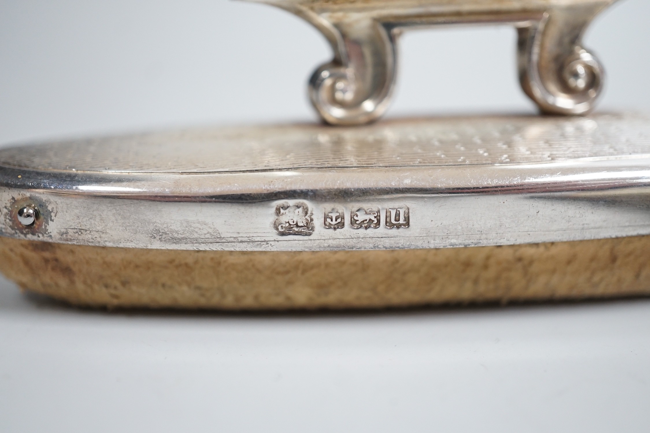 A small group of assorted manicure items and a leather travelling case containing a matched silver and mother of pearl travelling knife and fork.